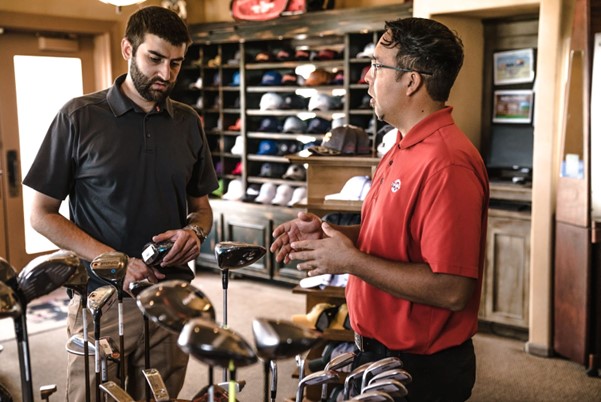 Two men in a golf retail shop